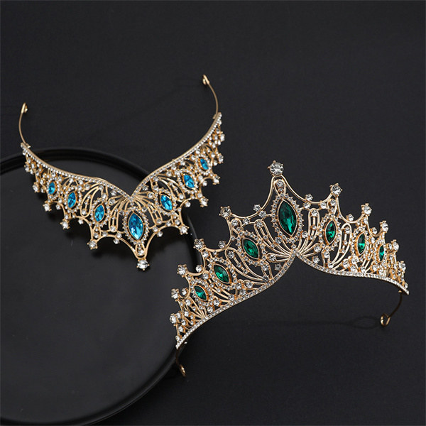 Decorative crown and necklace displayed together with colored accents