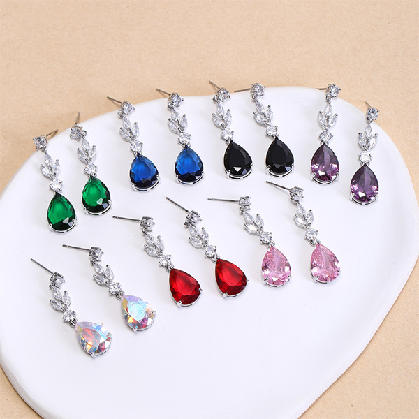 The same teardrop earring outline photographed with several apparent stone colors