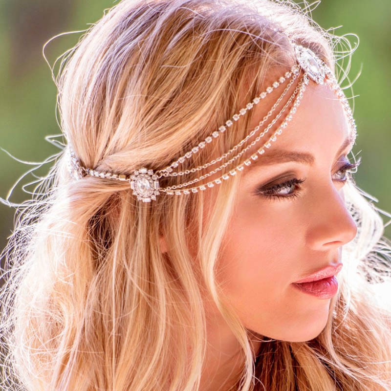 Fine draped hair chains shown from the side of a hairstyle