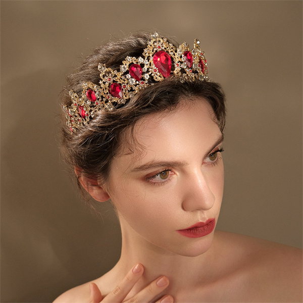 Prominent crown shape with red-appearing accents shown on a wearer