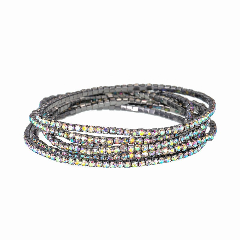 Several narrow rhinestone bracelets arranged in a stack